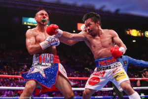 Manny Pacquiao punches Keith Thurman