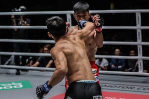 Yuya Wakamatsu punches Geje Eustaquio