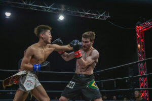 Kanta Motoyama punches Michael Walker 300x200