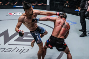 Kazuki Tokudome kicks Adrian Pang