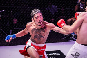 Teruto Ishihara punches Levi Mowles 300x200