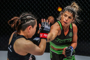 Julie Mezabarba punches Mei Yamaguchi