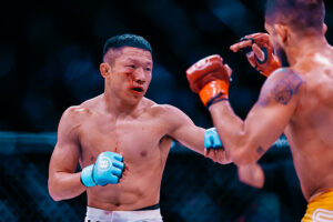 Kyoji Horiguchi punches Sergio Pettis during their Bellator bantamweight title fight