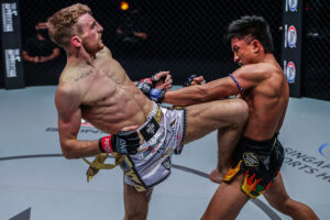 Jonathan Haggerty lands a long knee against Mongkolpetch Petchyindee at the Singapore Indoor Stadium