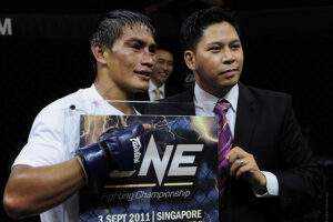 Eduard Folayang celebrates his win at ONE FC: 'Champion vs Champion' with president Victor Cui