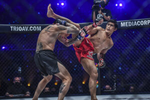 Eduard Folayang kicks John Wayne Parr during their Muay Thai bout at ONE: 'X' at the Singapore Indoor Stadium