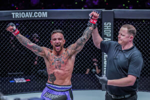 Liam Harrison celebrates beating MuangthaiPKSaenchaigym after their Muay Thai fight at ONE 156 at the Singapore Indoor Stadium