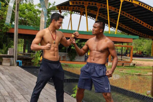 Kickboxing legends Superbon and Buakaw posing together at the Banchamek Gym in Chiang Mai