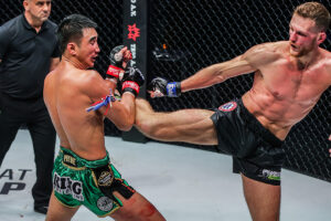 Jimmy Vienot kicks Petchmorakot Petchyindee during their featherweight Muay Thai title fight at ONE 157 in Singapore